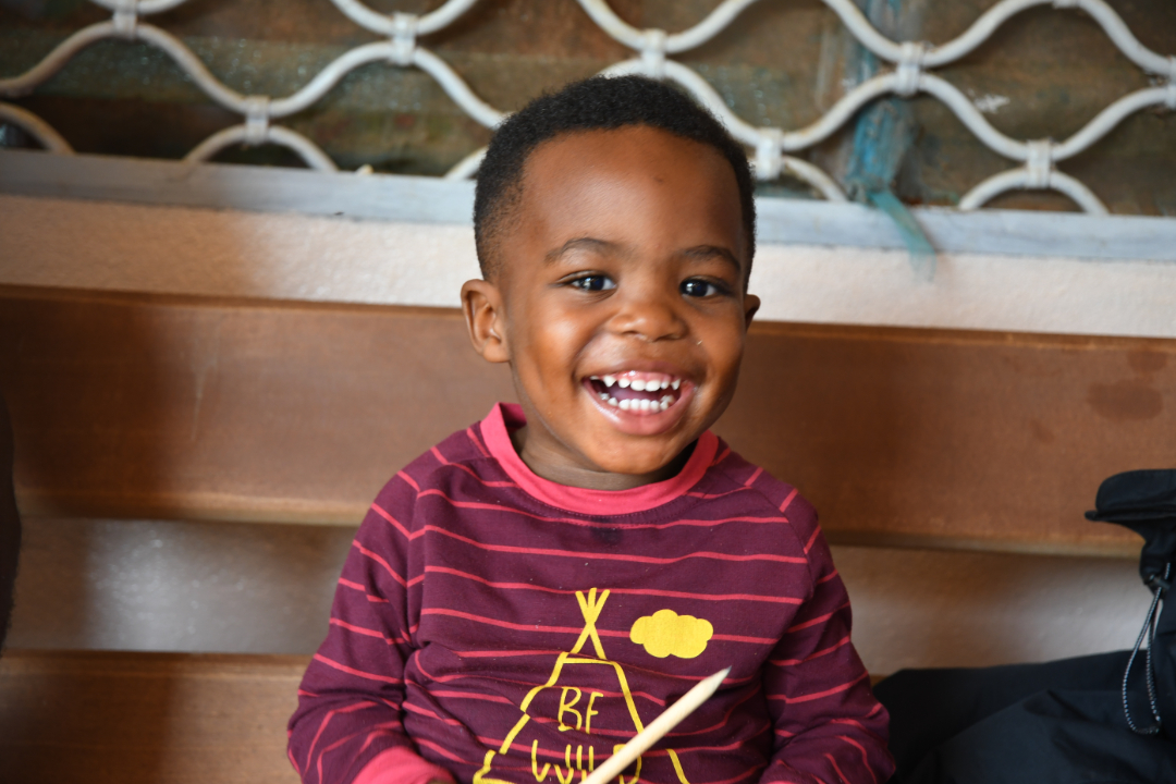 Photo d'un enfant camerounais souriant pour l'association humanitaire ADH 65